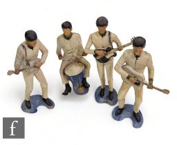 A collection of four NEMS Enterprises Revell Inc plastic moulded figures of the Beatles John,