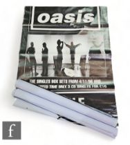 A collection of four Oasis large format record store album teaser music posters, together with a