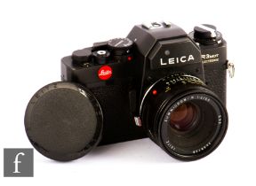 A Leitz Portugal Leica R3 MOT Electronic SLR Camera, 1979, black, serial no. 1509633, with a Leitz