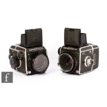 Two Zenza Bronica medium format SLR cameras, serial numbers CB315000 and CB305495.