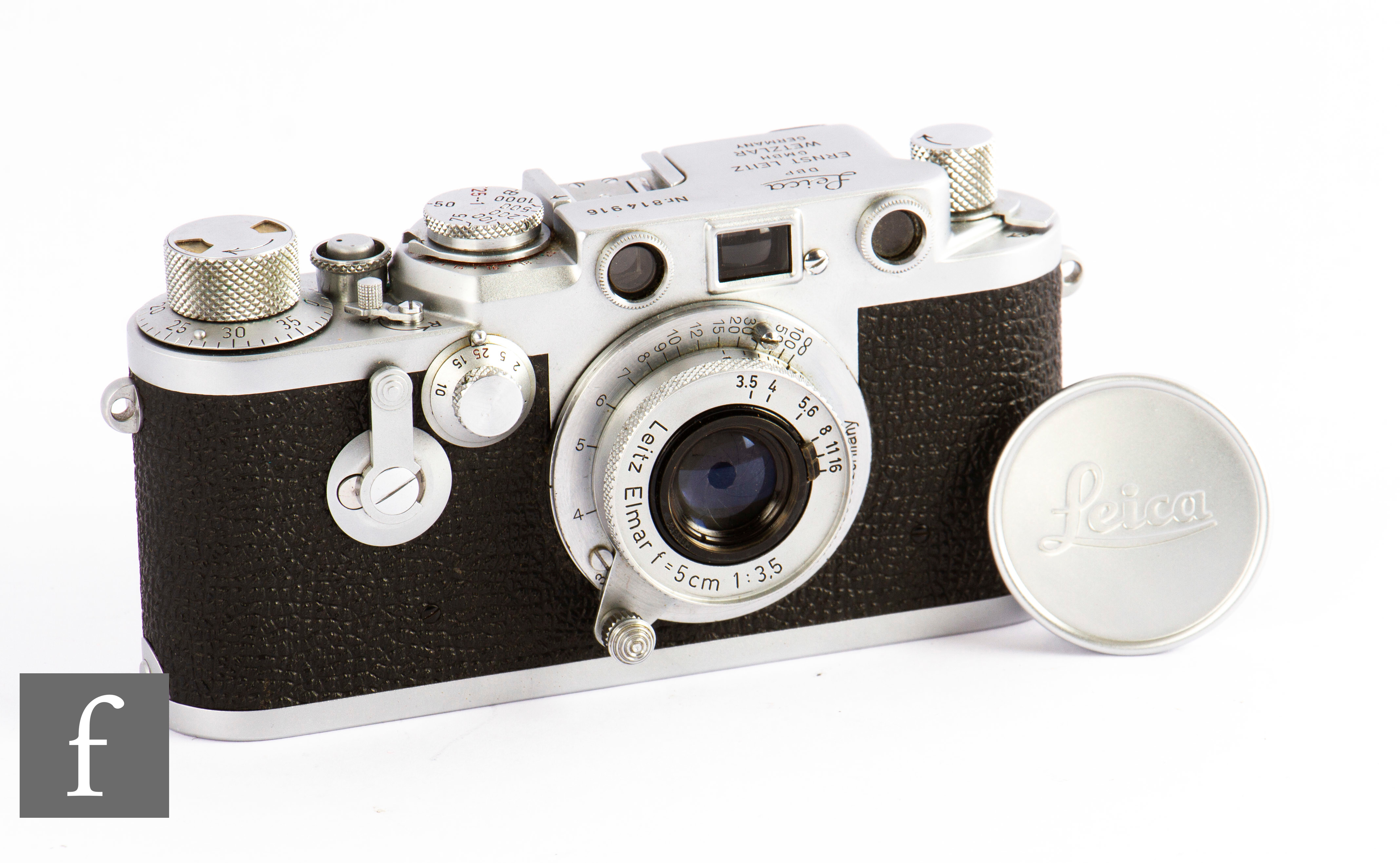 A Leica IIIf, circa 1956, with Leitz Elmar F1:3.5 50 lens, ‘Red Dial’, chrome body, serial number