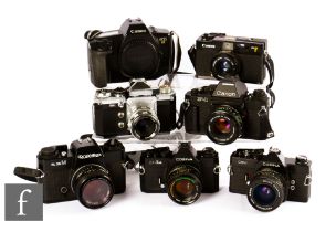 A collection of 1970s/80s SLR cameras, to include Canon A35F, Cosina C5-1A, Canon F-1, Cosina CSM,