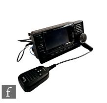 An ICOM IC-705 HF/VHF/UHF all mode mobile transceiver with a ICOM HM-243 microphone.