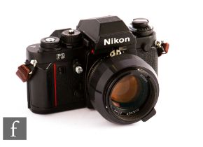 Nikon F3 35mm SLR film camera, serial number 1350823, black, with Nikkor 50mm f:1.4 lens