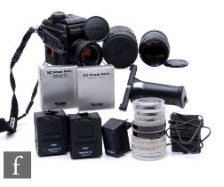 A Rollei Rolleiflex 3003 SLR camera outfit, with Rolleinar-MC f28 135mm lens, serial number 7606984,