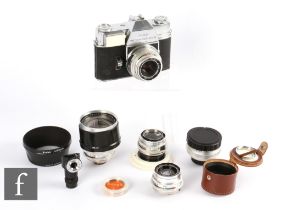 A Kodak Retina Reflex III outfit, with additional lenses and accessories.
