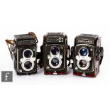 A collection of three Yashica medium format twin lens reflex film cameras, circa 1970s, to include