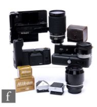 A collection of Nikon camera accessories, to include an F36 motor drive, black, serial number