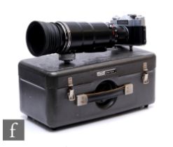 A Zenit ES with Photo Sniper f/4.5 300mm lens with metal photosniper carry case, together with a