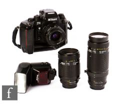 A Nikon F4 camera outfit, serial number 2273943, with Nikon 75-300mm f/4.5-5.6 lens, together with