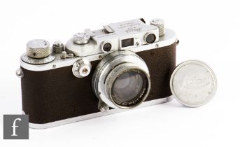 A Leica IIIa, circa 1936, with Leitz Wetzlar f1:2 50 lens, chrome body, serial number 195537.