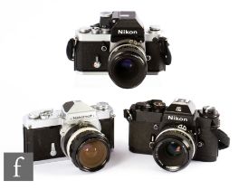 A collection of Nikon SLR 35mm cameras, to include Nikon EL2, serial number 7905913, with Nikkor