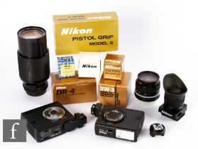 A collection of Nikon camera accessories and various lenses, to include boxed items DR-4, right