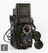 A Yashica Mat-124 G medium format TLR camera, serial number 213224, sold with case.