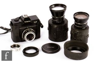 A Rolleiflex SL25 camera outfit, comprising body and three various lenses.