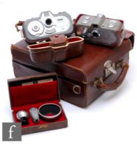 A Zeiss Ikon Movinette camera outfit, to include 8 and 8B, together with additional cased lens, hood