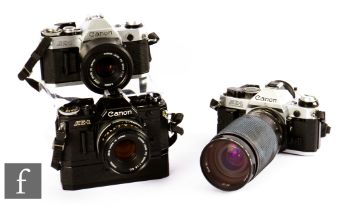 A group of Canon SLR 35mm cameras, to include Canon AE-1, serial number 2547477, with Tamron 35-