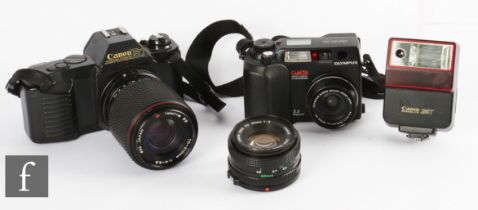 Two 35mm rangefinder and SLR cameras, to include Canon T50 with Canon f2 50mm lens and Tokina f4-5.6