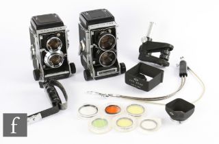 A Mamiya C3 medium format camera outfit, to include two C3 cameras and various lenses and