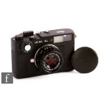 A Leica CL with Summicron F2/40 lens, black body, serial number 1396842.
