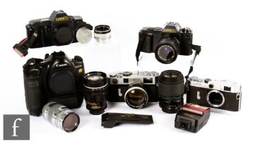 A group of Canon cameras, to include Canon EF outfit, a Canon 7S, to include two camera bodies,