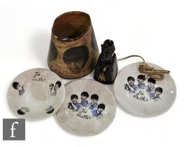 A group of Beatles collectibles to include an original 1960s lamp shade and two Beatles plates and a