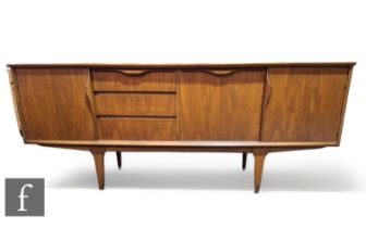 Unknown - A teak sideboard fitted with a central bank of three drawers, with fall-front drinks