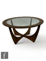 G-Plan - A 1970s Astro teak and glass topped coffee table, height 46cm, diameter 85cm.