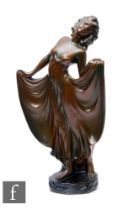 G Leonardi - A large 1930s Art Deco plaster cast modelled as a lady in flowing robes, with a bronzed