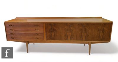 Robert Heritage - Archie Shine Ltd - A walnut veneered 'Hamilton' sideboard, with a shallow ledge