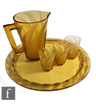 Rene Lalique - A 1930s Hesperides part drinking suite, comprising large jug, three tumblers and a