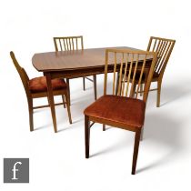 Vanson - A mid Century teak extending dining table with tapered block supports, one extra leaf,