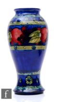 William Moorcroft - Banded Pomegranate - A large vase circa 1925, the inverted baluster form tube
