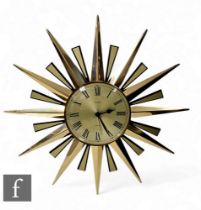 Metamec - A 1960s 'Sunburst' wall clock, the central champagne dial with Roman numerals and a series