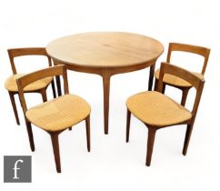 Nathan Furniture - A mid Century teak circular extending dining table, together with four low back