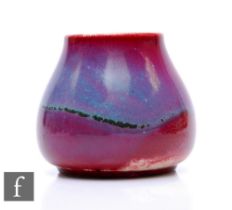 Ruskin Pottery - A small 1930s pottery vase of low shouldered form with tapered upper body,