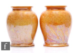 Ruskin Pottery - A pair of 1930s Pottery vases, each of footed shouldered ovoid form with everted