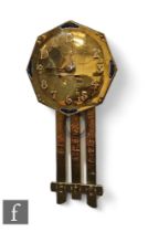 Unknown - An early 20th Century brass wall clock, the octagonal face with repousee numbers with four