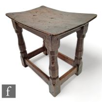 Robert 'Mouseman' Thompson - Mouseman - A 1930s oak joint stool, with burr oak dished top, on carved
