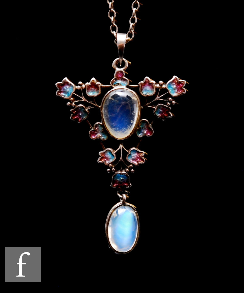Attributed to Jessie M.King - Liberty & Co - An open work silver, enamel and moonstone pendant circa