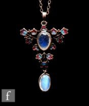 Attributed to Jessie M.King - Liberty & Co - An open work silver, enamel and moonstone pendant circa