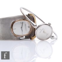 Michel Herblain - A 1970s lady's bangle wristwatch, the plain dial mounted to a thin white metal