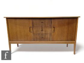 Peter Hayward - W.G Evans (Vanson) - A walnut veneered sideboard fitted with a central bank of three