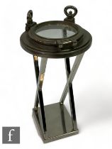 Eichholtz - A porthole 'HMS Victory' side table, with nickel finish and lucite circular top,