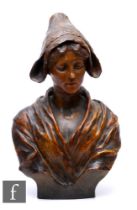 Goldscheider - An Art Nouveau cold painted terracotta bust of a Breton girl, model 2606,