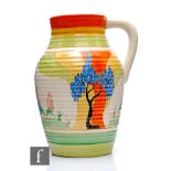 Clarice Cliff - Windbells - A single handled Lotus jug circa 1932, hand painted with a stylised tree