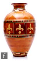 Bill Robinson - A contemporary segmented woodturned vase of ovoid form with everted flared rim,