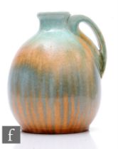 Ruskin Pottery - A large 1930s pottery jug of ovoid form with narrow collar neck and stylised tear