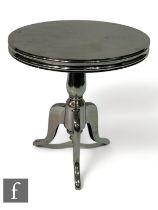 Eichholtz - A nickel finish bistro style table, raised on a tripod baluster base with circular plain