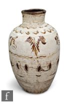 A Chinese Cizhou type vase, with brown and white slip-painted decoration of foliage below banded